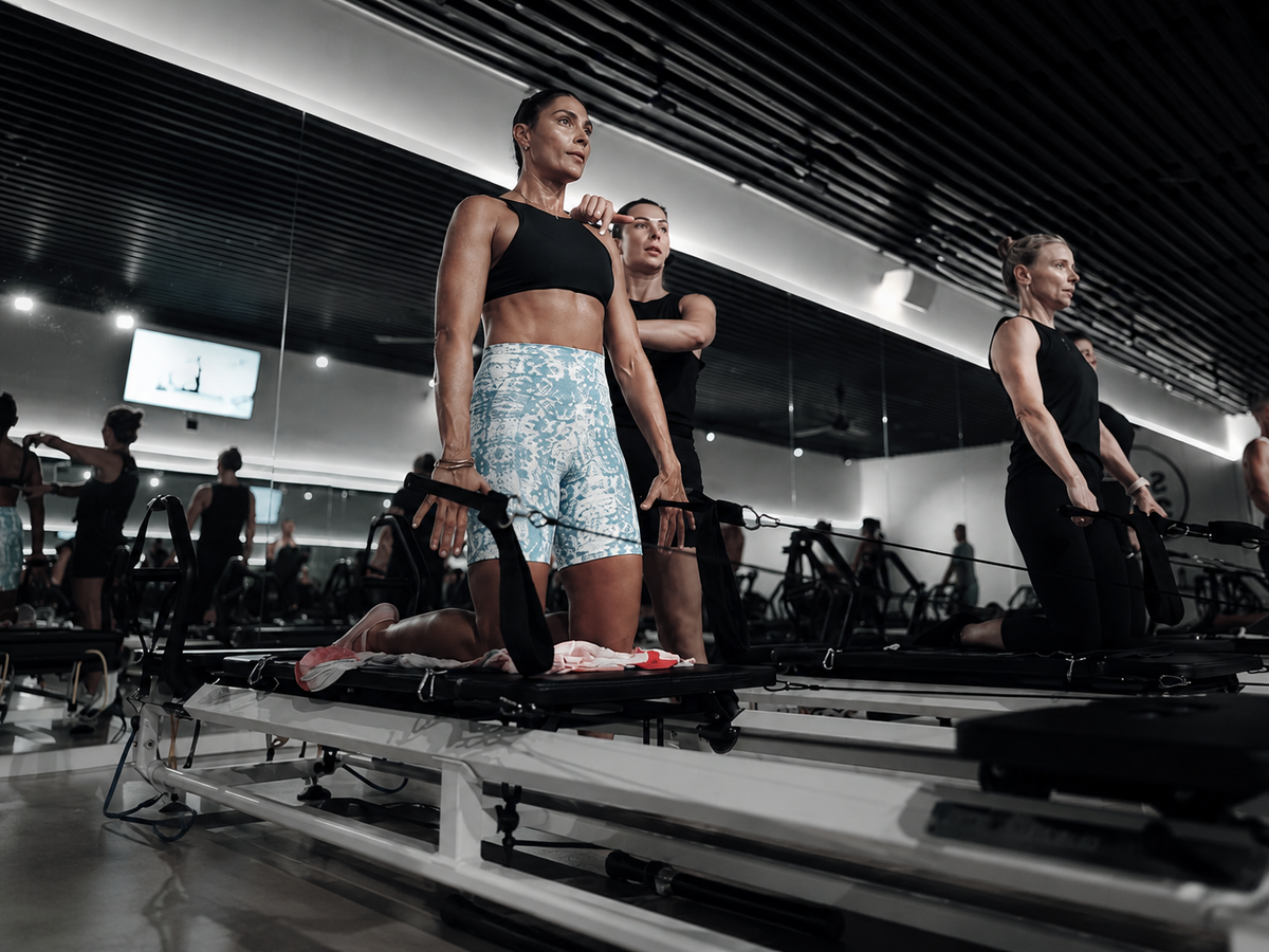 Diana teaching a reformer class in the studio.